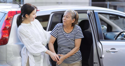 woman assisting an elderly woman