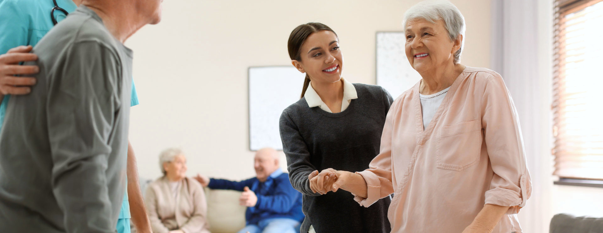 aide and elderly woman smiling