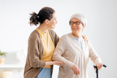 elderly woman talking to woman