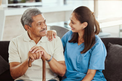 aide talking to an elderly man