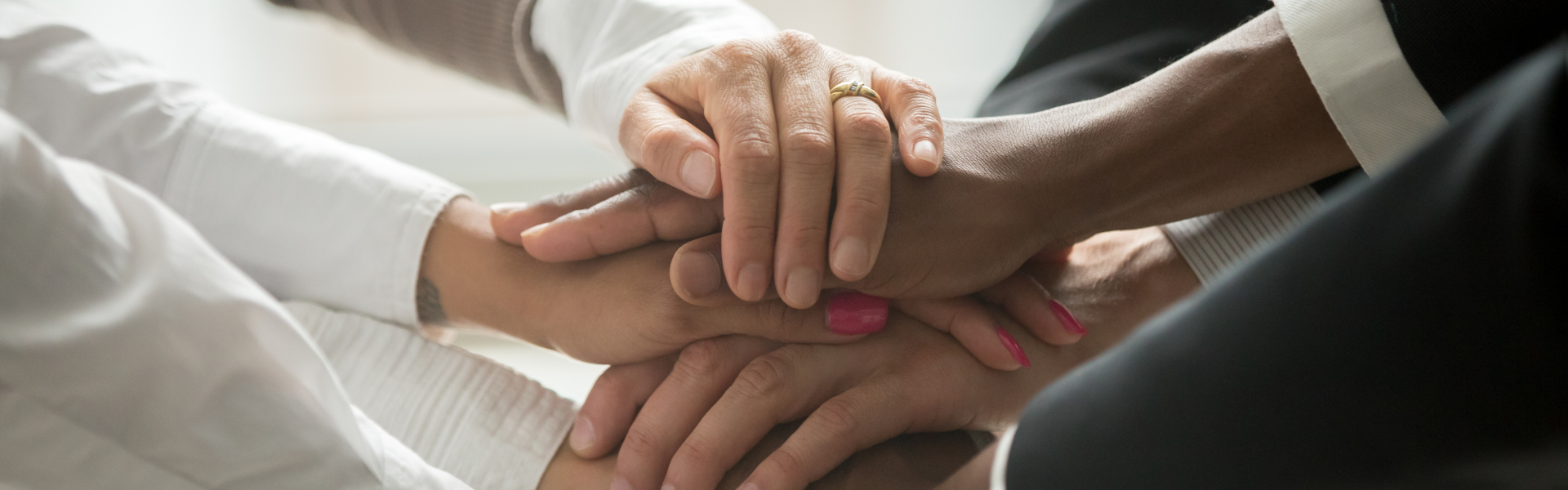 stacking hands of a group of people