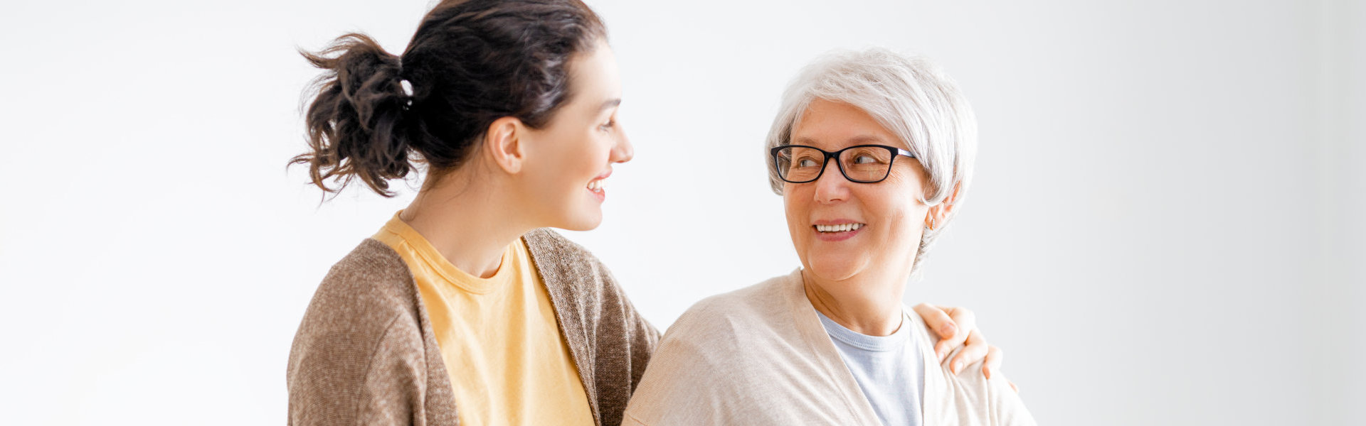 elderly woman talking to woman