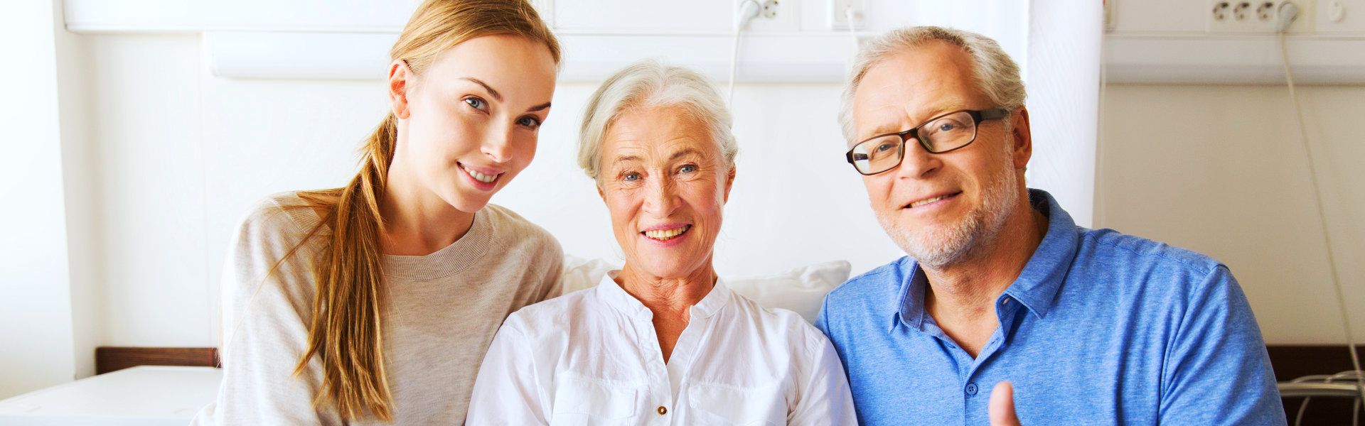 three people smiling