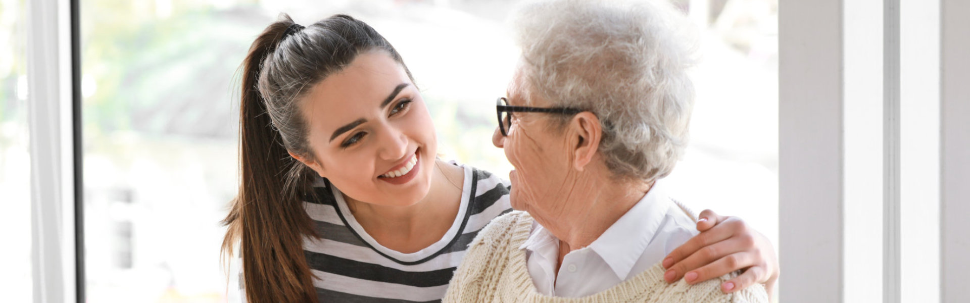 young woman talking to an elderly woman