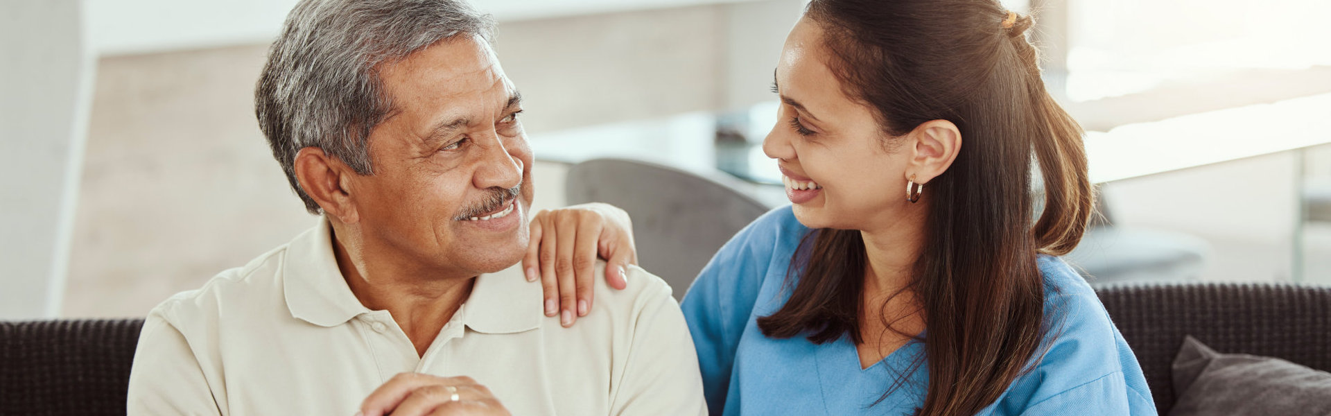 aide talking to an elderly man